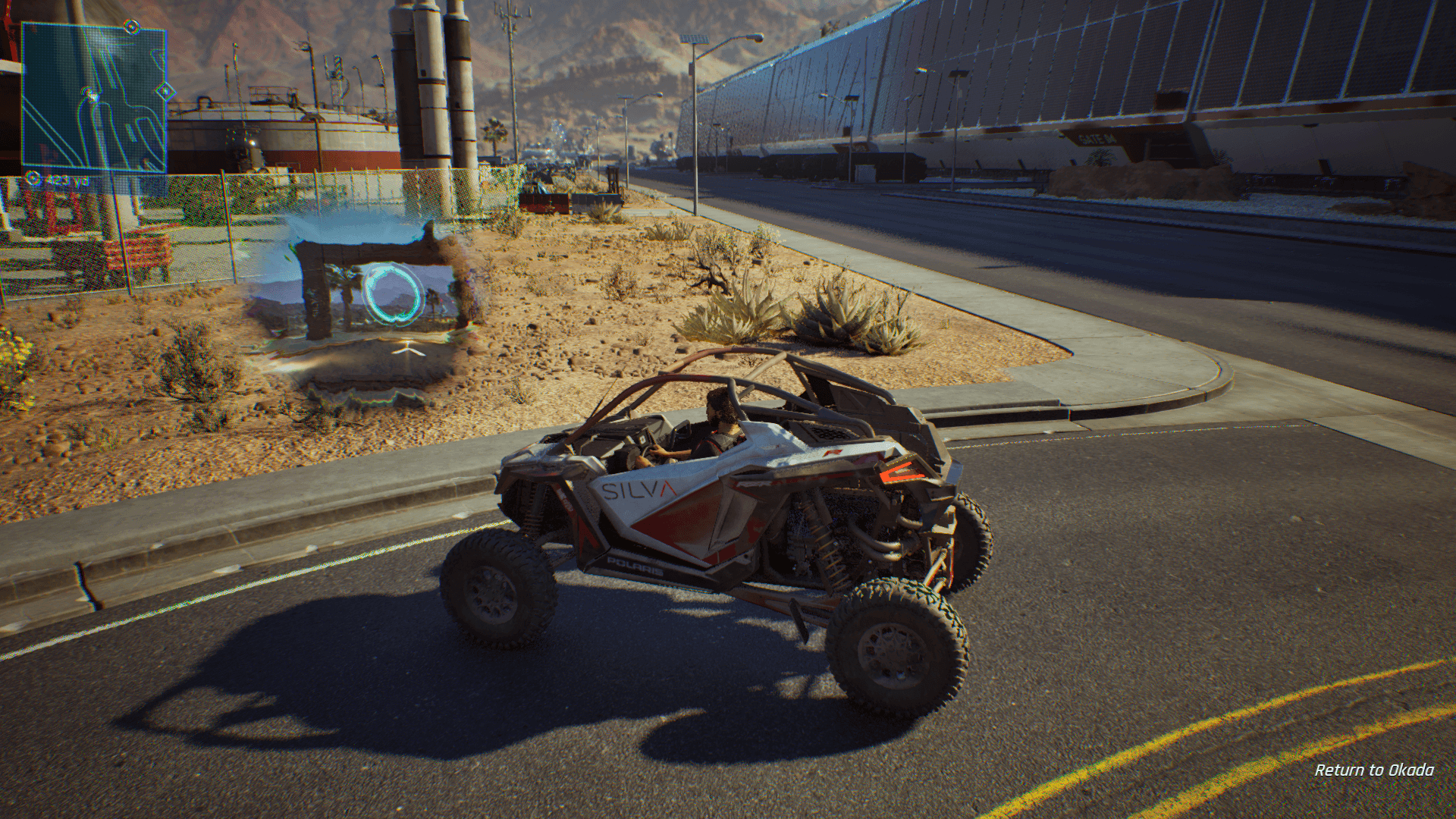 A dune buggy is parked next to a portal that shows a structure with a glowing cyan ring.