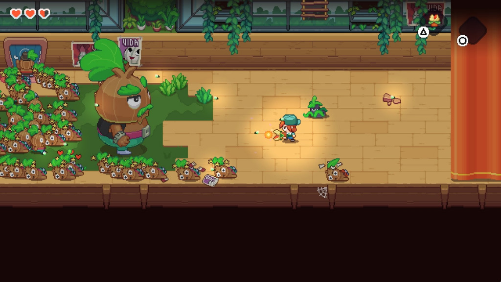 Nia fires her ranged weapon at a boss enemy, which looks like a giant onion wearing pants and a vest. Countless smaller versions of the boss lay unconscious around it.