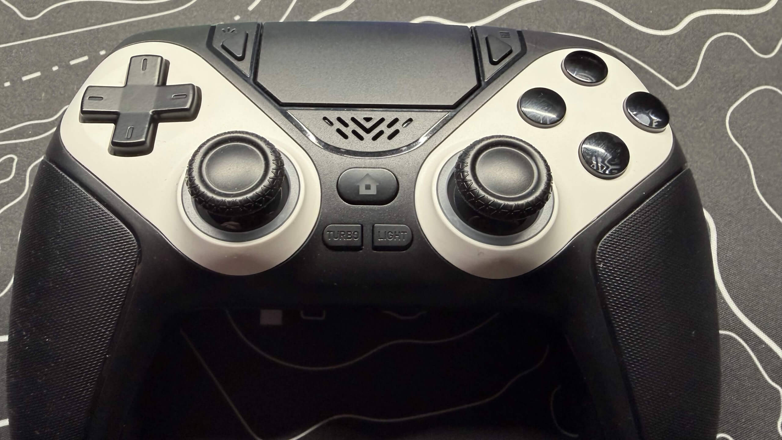 image of the gamrombo led wireless controller close up showing the similar layout of playstation controller