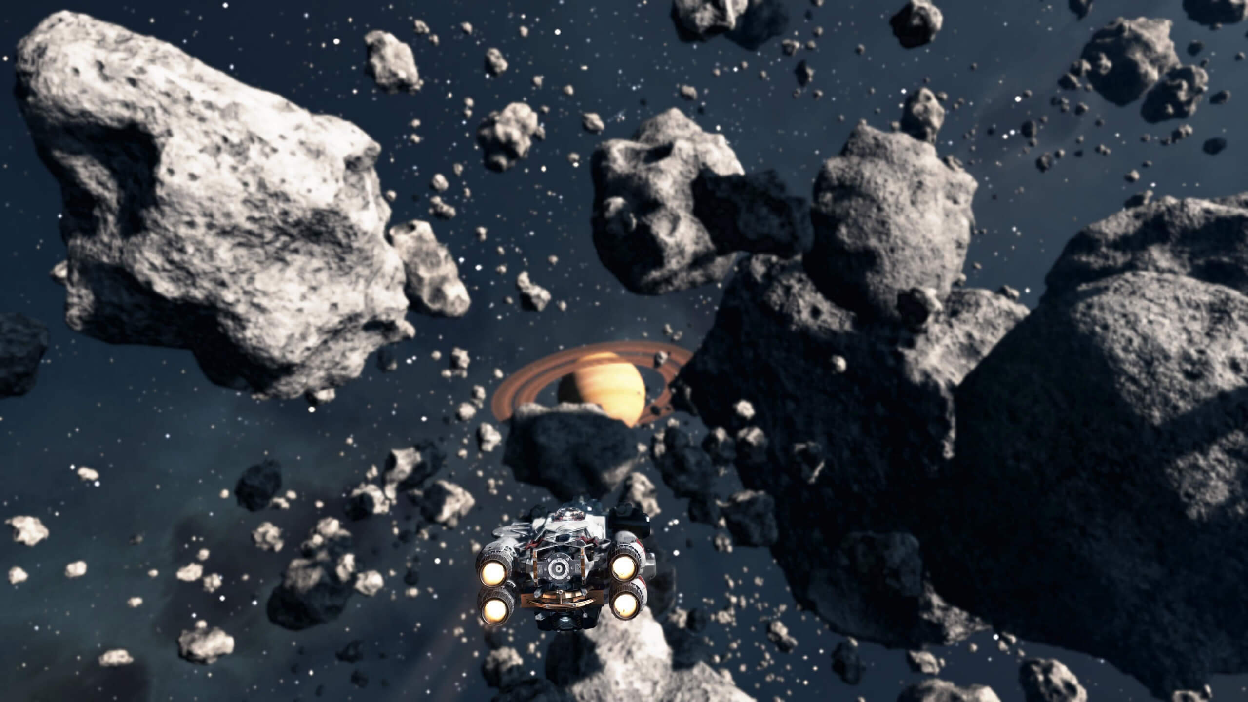 image of asteroid field with ship flying towards it