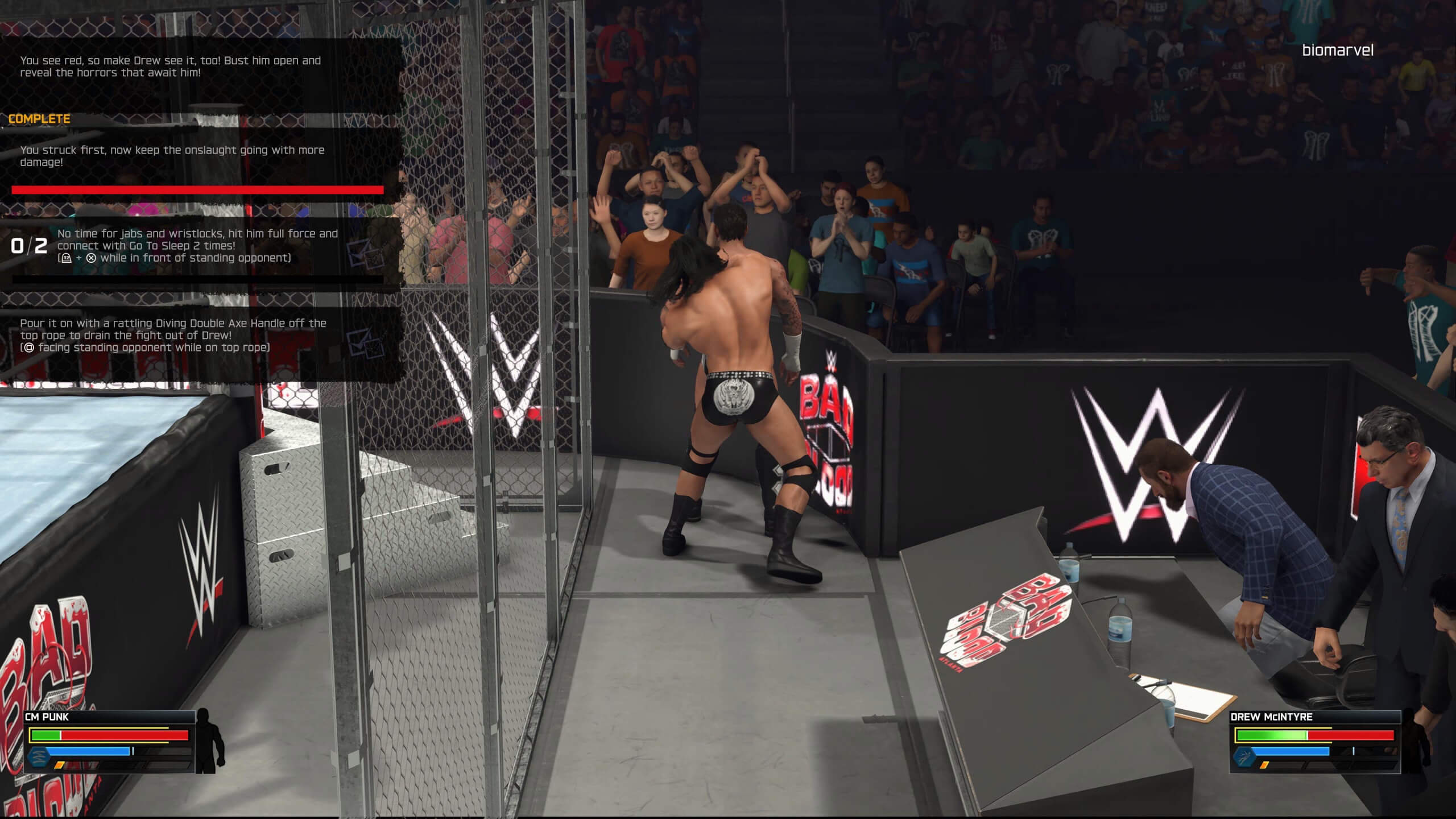 screenshot showing a cage match with objectives in the corner