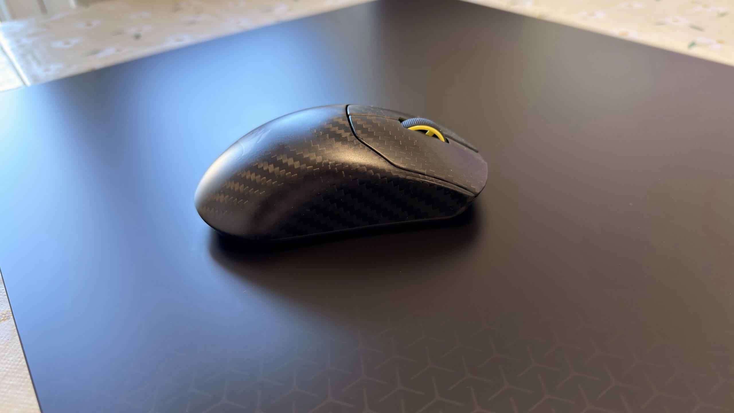 image of the sabre v2 pro on a the mm glass mouse pad