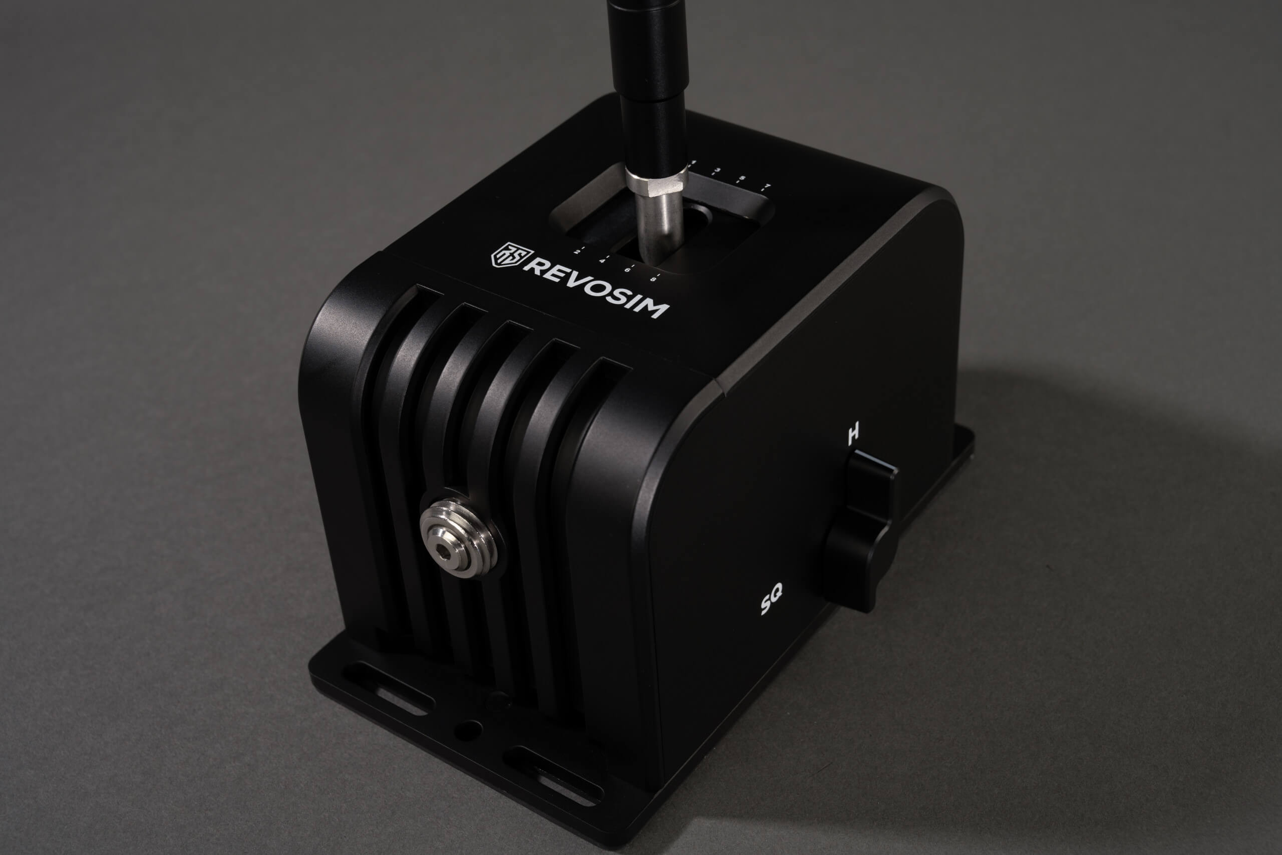 the base of the shifter with the change switch on the side