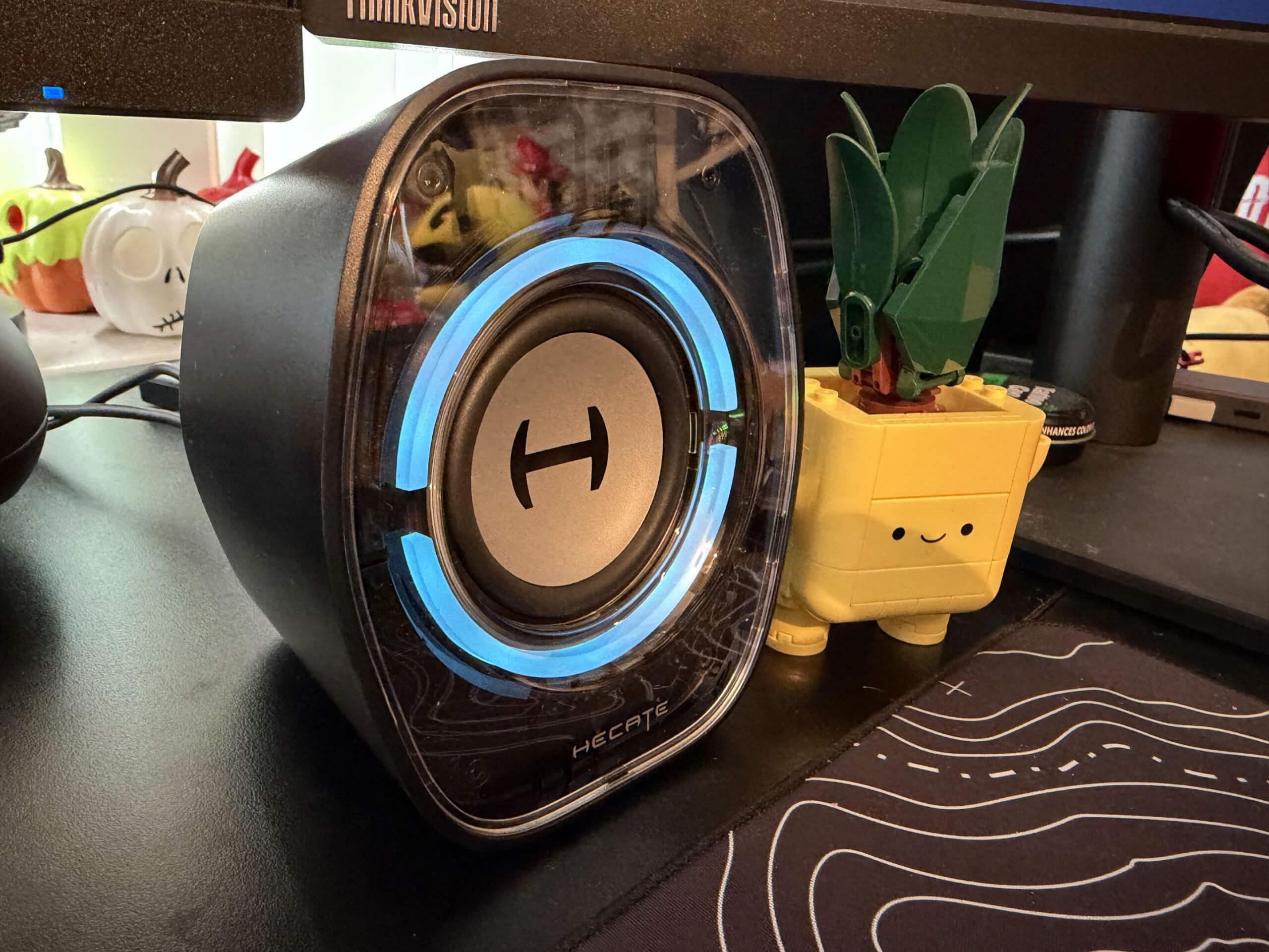 the edifier g1000 II speakers on a desk next to a lego plant