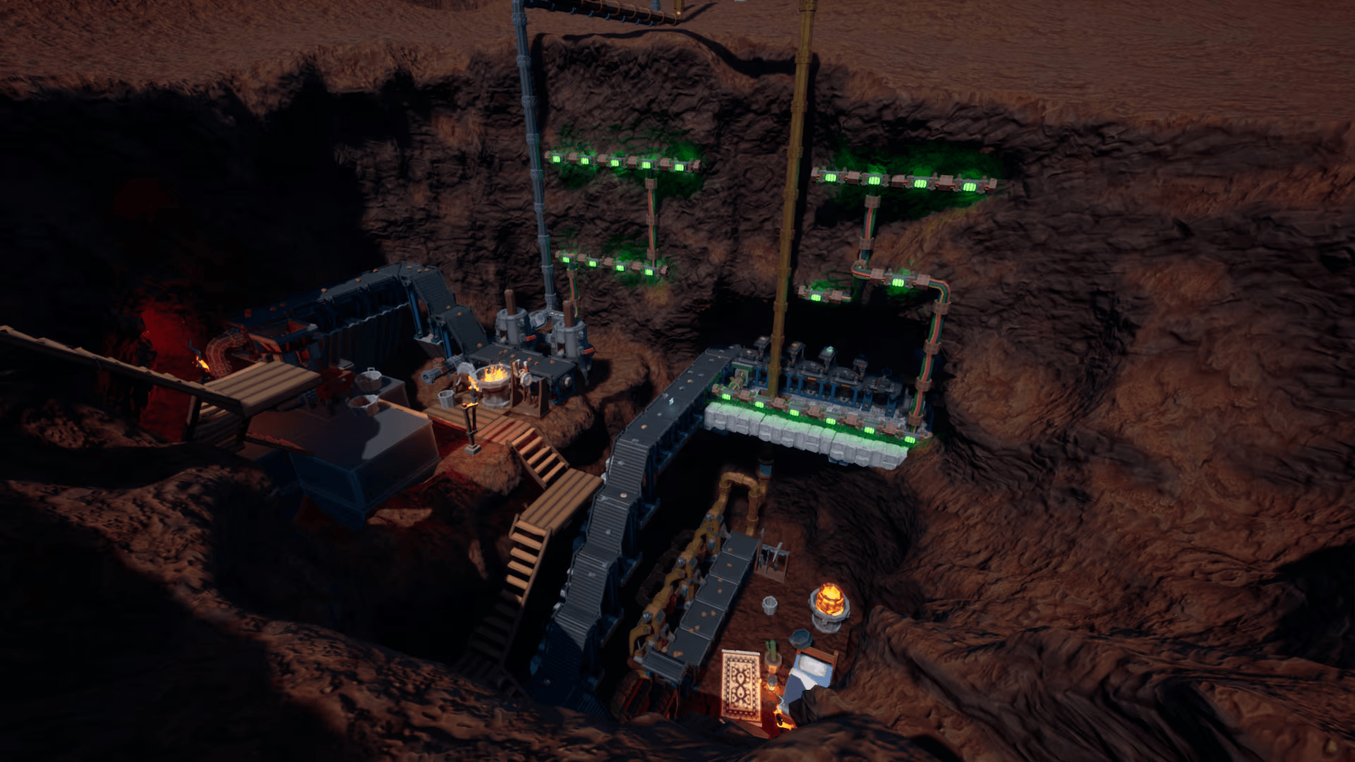 An automated factory full of pipes and machniery sits inside a deep hole dug from the earth.