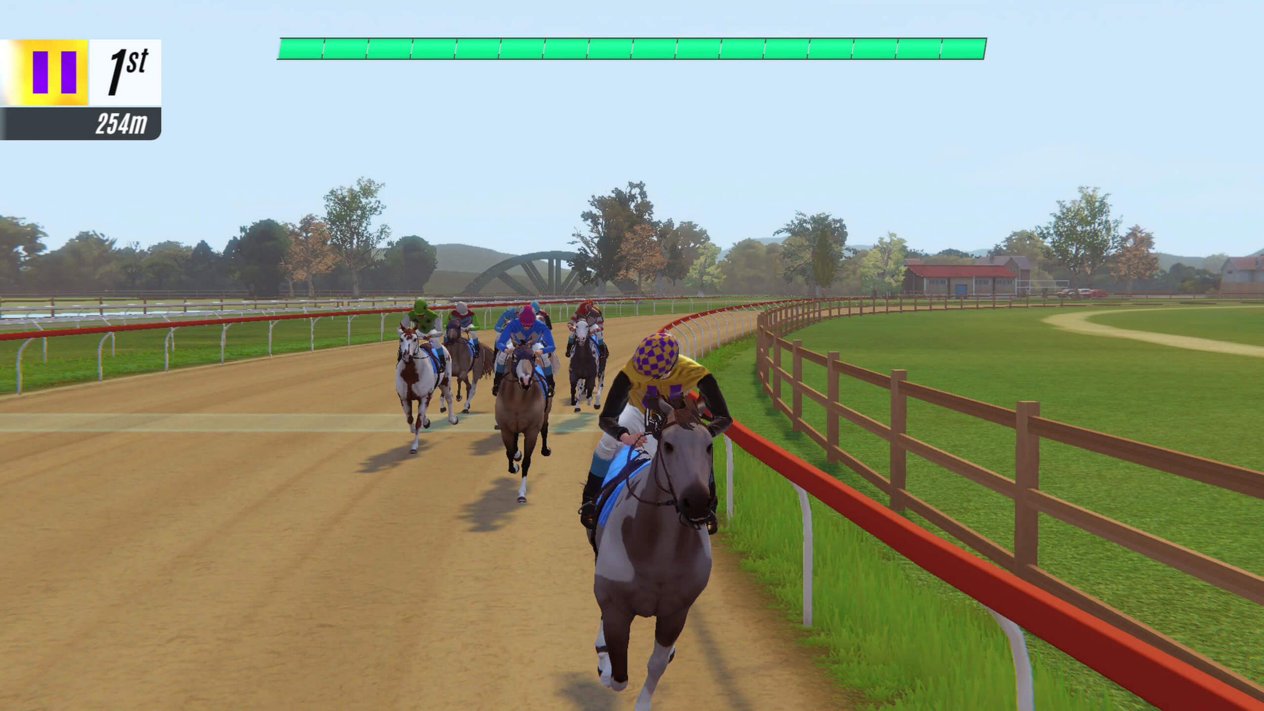 A jockey in a checkered helmet leads a horse race on a dirt track, with other riders following closely. The scene conveys excitement and competition.