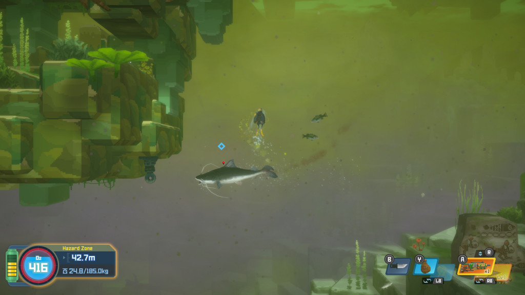 Underwater scene in a video game showing a diver near large fish and aquatic plants among blocky rock formations.