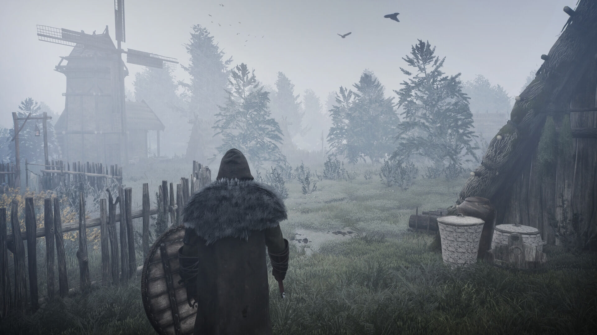 A hooded character with sword and shield drawn, walks towards a small wooded area, shrouded in mist.
