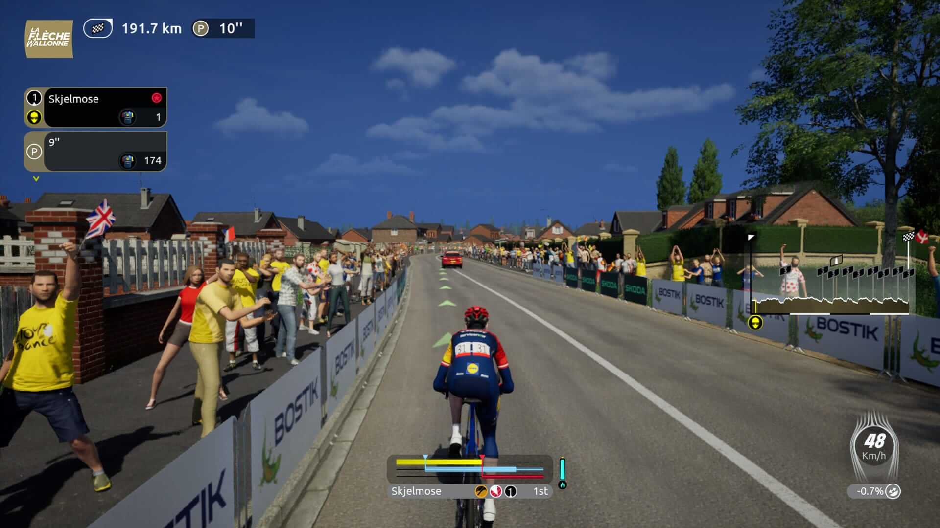 A cyclist competes in a race with enthusiastic spectators cheering along the roadside, showcasing a vibrant atmosphere.