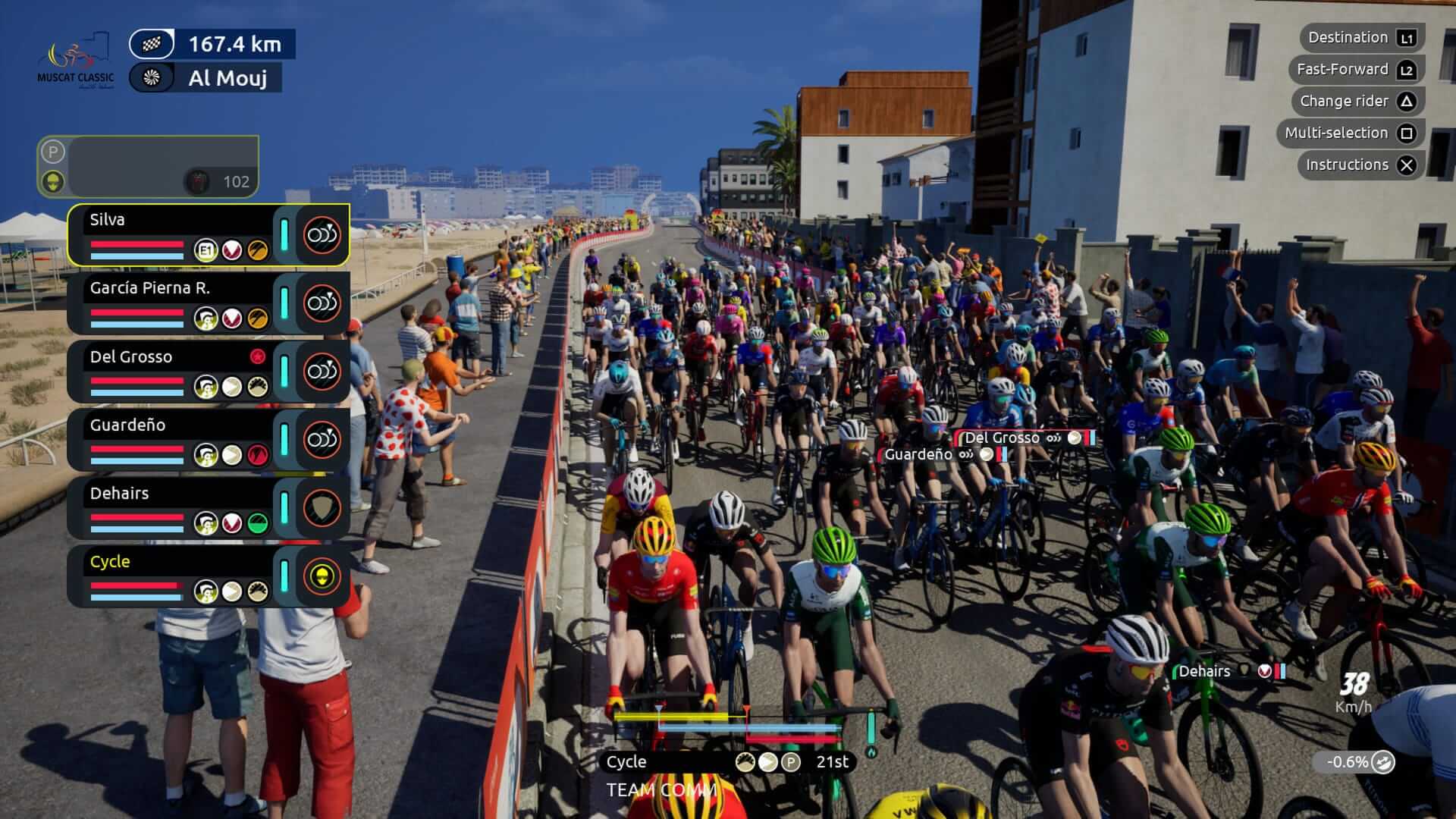 A vibrant cycling race scene at Al Mouj, featuring numerous cyclists and enthusiastic spectators along the route.