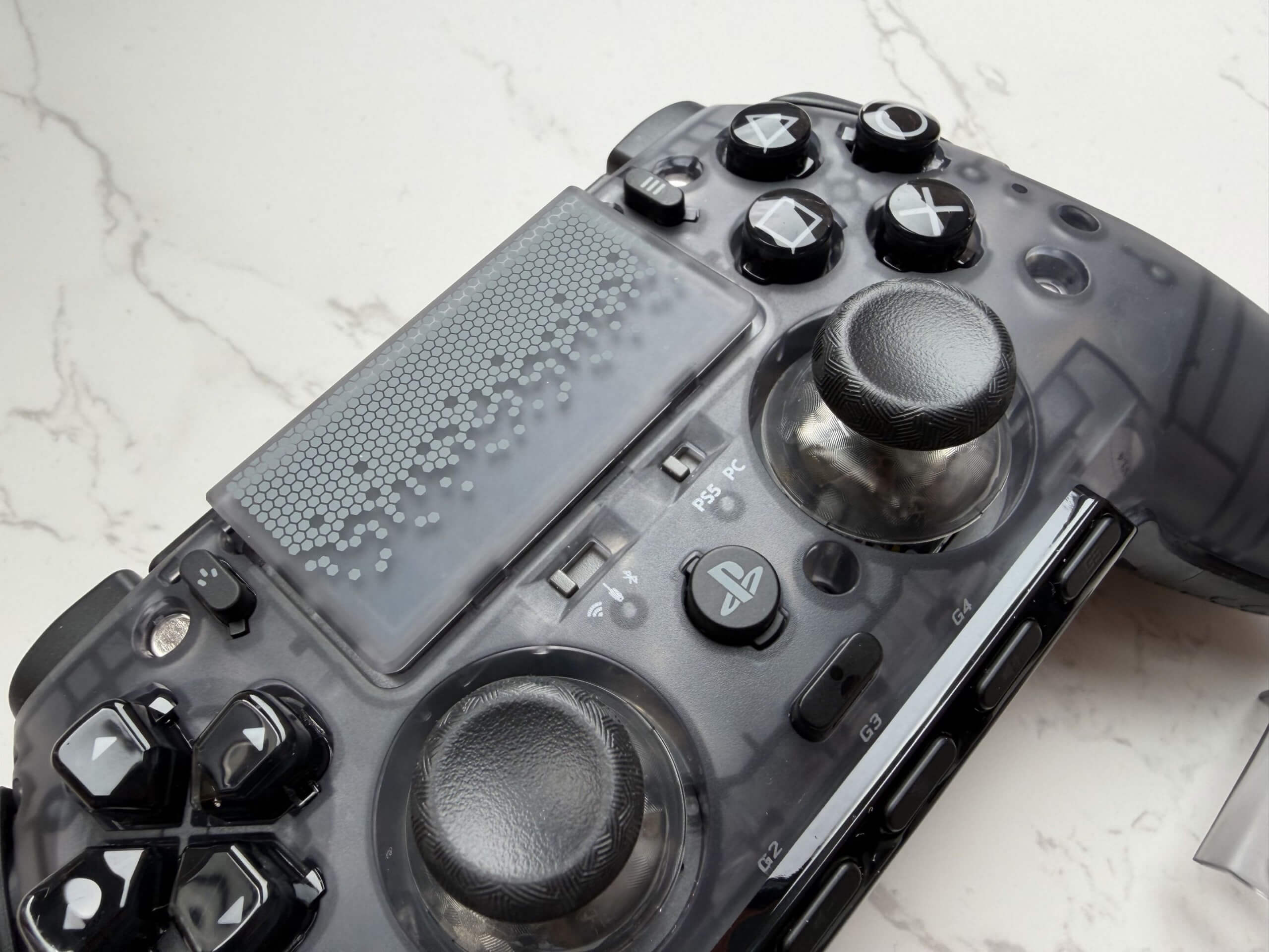 image of the scuf omega with the front panel off showing the switches for changing connection type