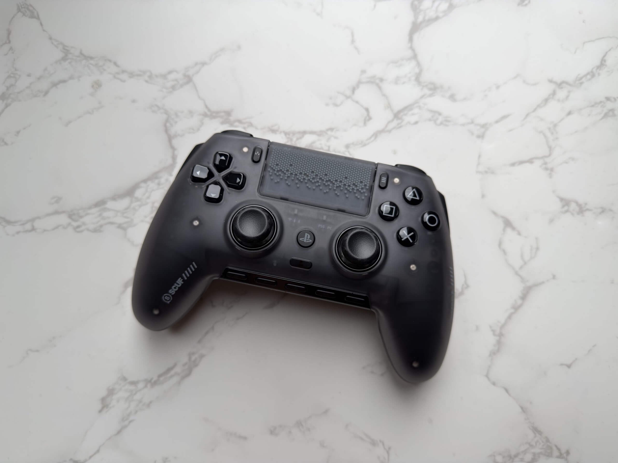 image of the scuf omega face up on a table