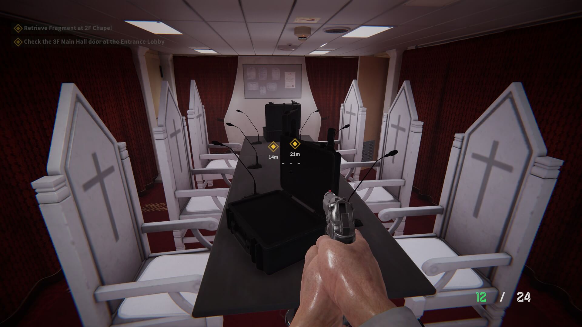 A small room filled with white chairs branded with a religous cross. The walls have red curtains, and boxes are sat on a wooden table. A gun is being held in the hands of the player, with aforementioned hands being covered in sweat with little bits of blood.