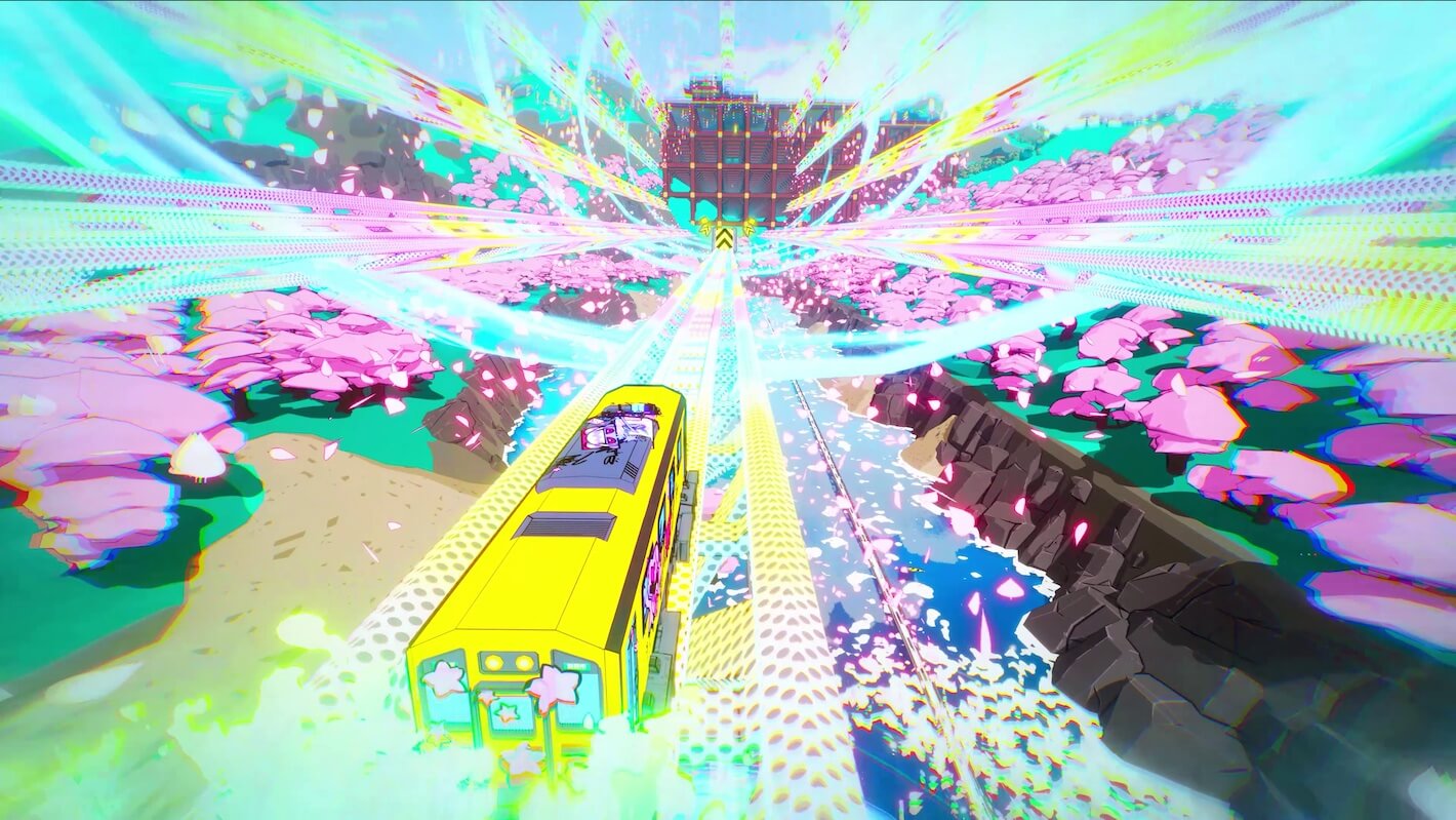 A yellow train travels down a track with cherry blossoms on either side.
