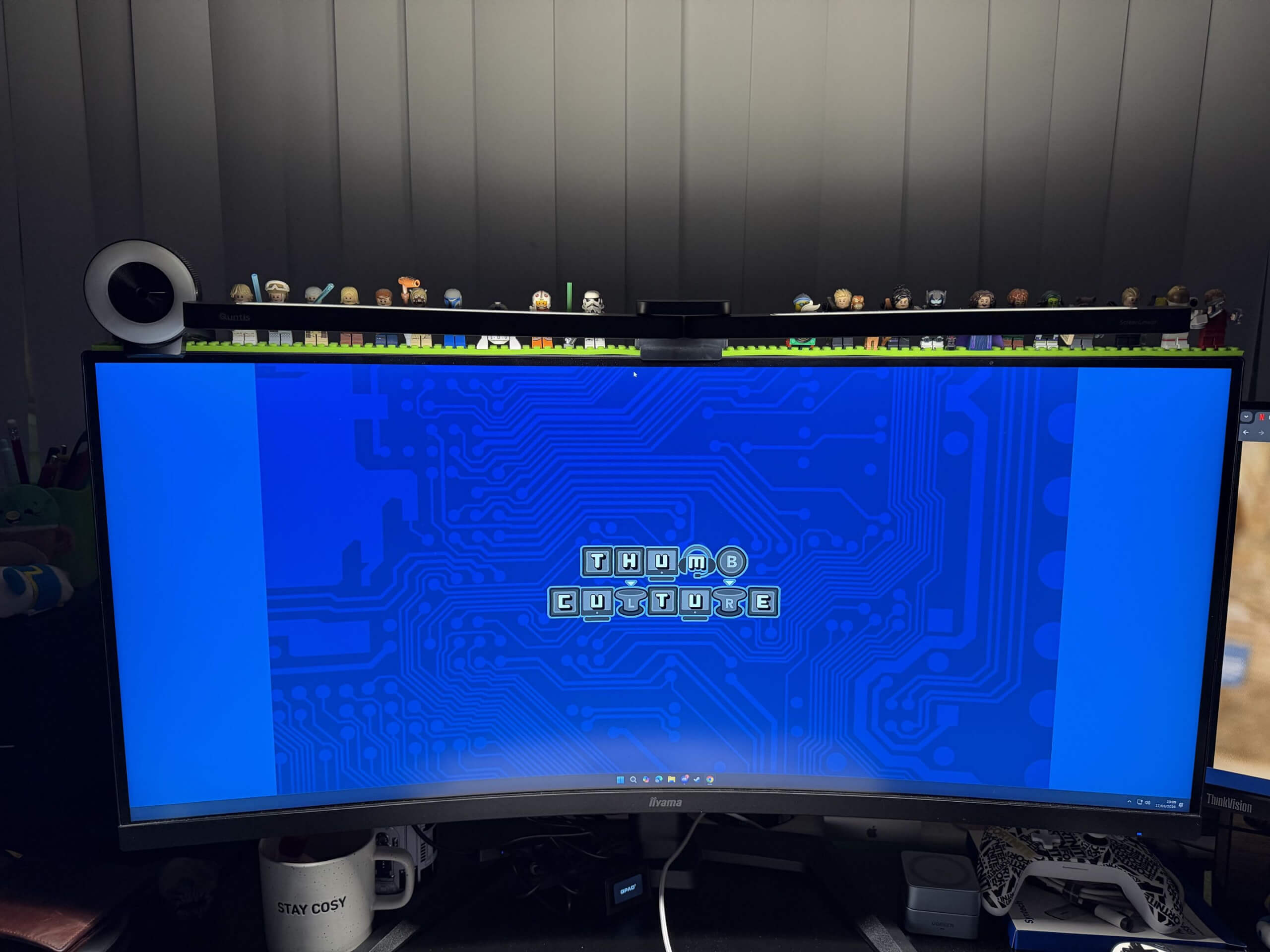 the light bar sat on top of a monitor with the thumb culture logo and background on it