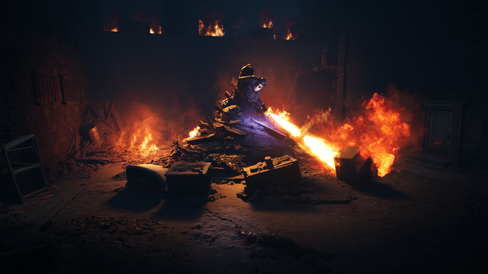 A large man with a flamethrower is stood atop rubble which is also surrounded by flames. He is igniting the area around him.
