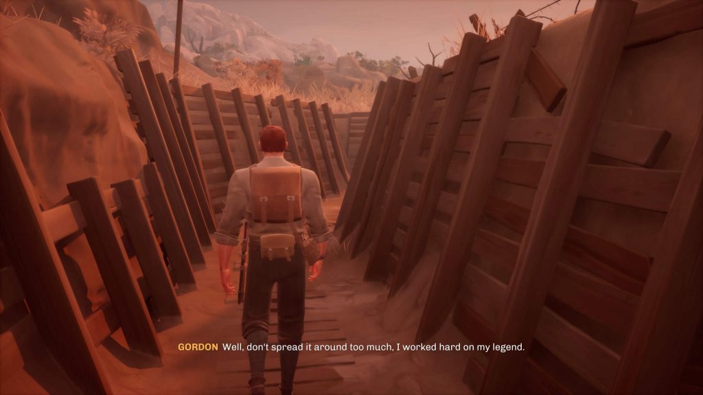 A man with a backpack walks through a wooden trench with barbed wire overhead in a reddish, desert-like environment.
