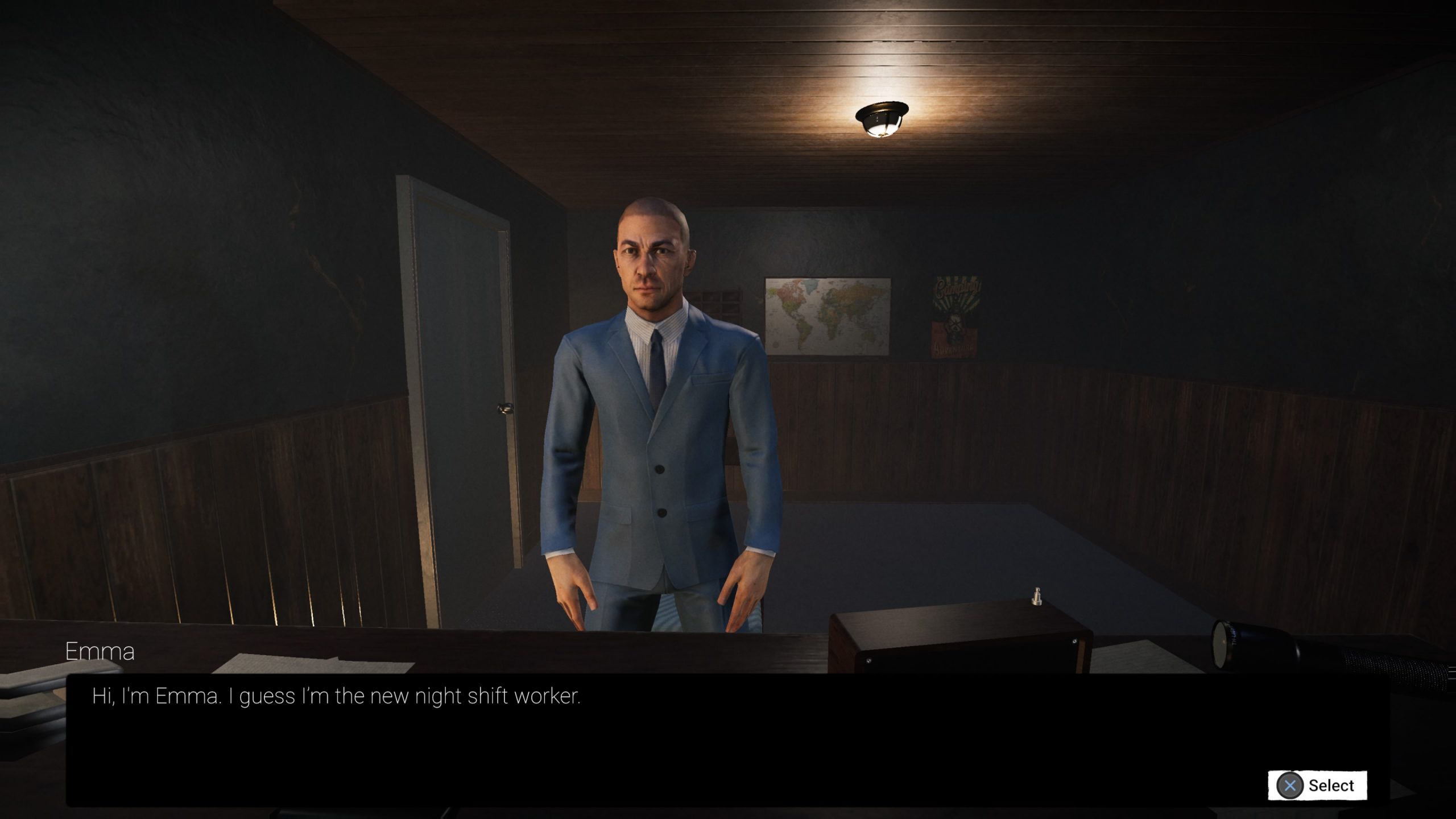 A man in a blue suit with white shirt, and black tie is stood behind a desk. Behind him is a poster and a map of the world. A black dialogue box at the bottom is from Emma saying she is the new night shift worker.