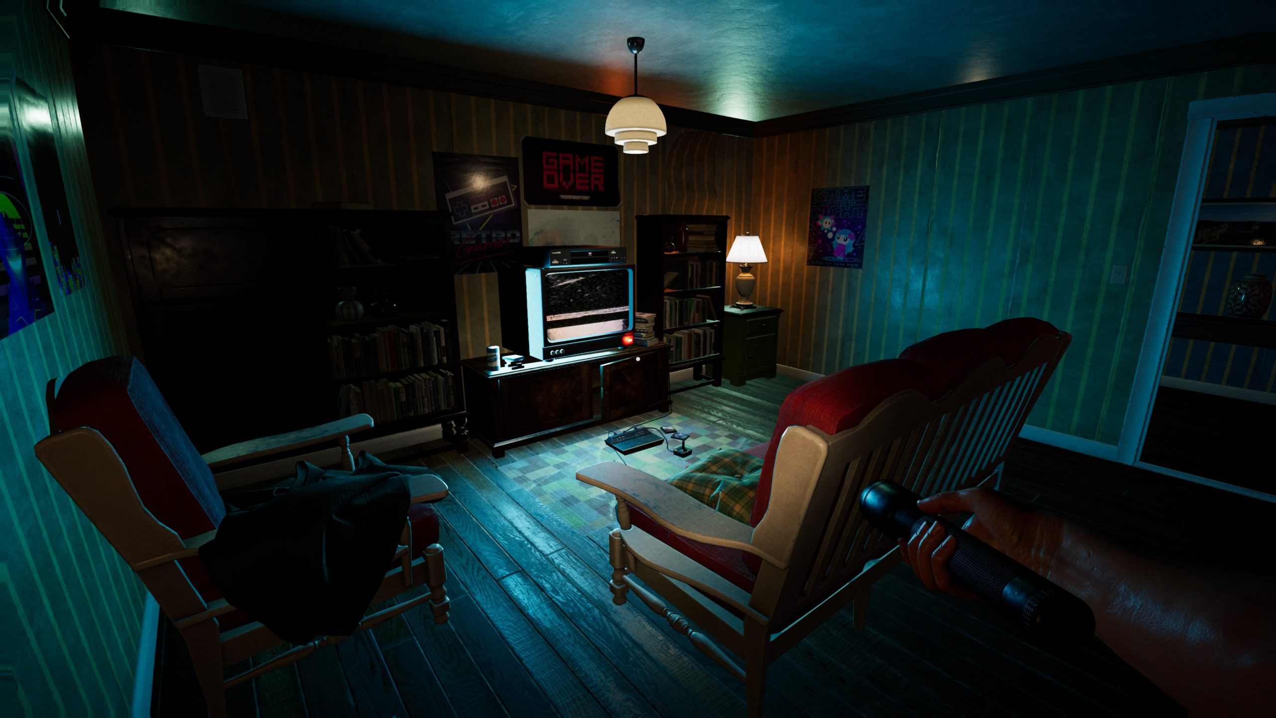 A living room with a sofa in the centre with a T.v. in front of it. The television is displaying just static while on. There are also shelves filled with books and movies.