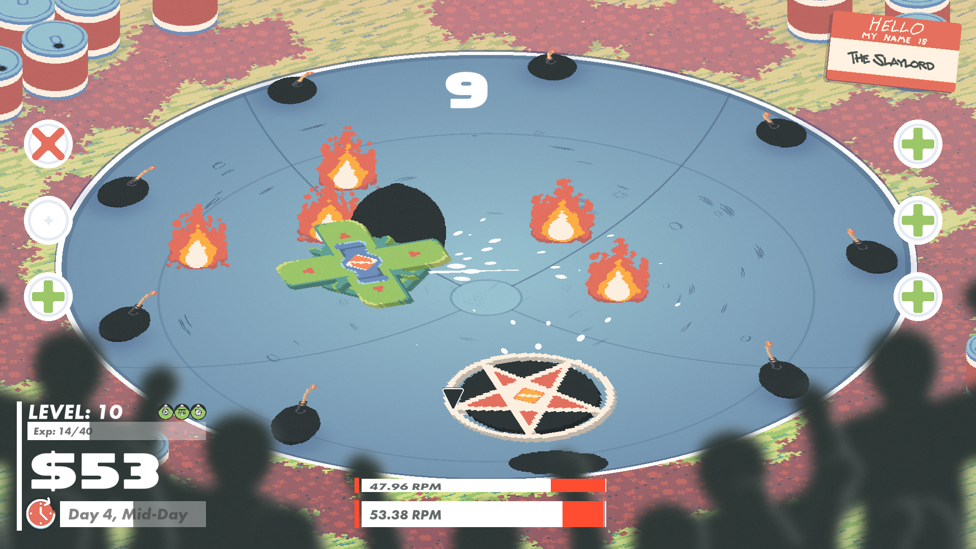 A large blue arena with two large Slayblades battling head to head. In the arena are also obstacles for both players to avoid such as bombs and fires.