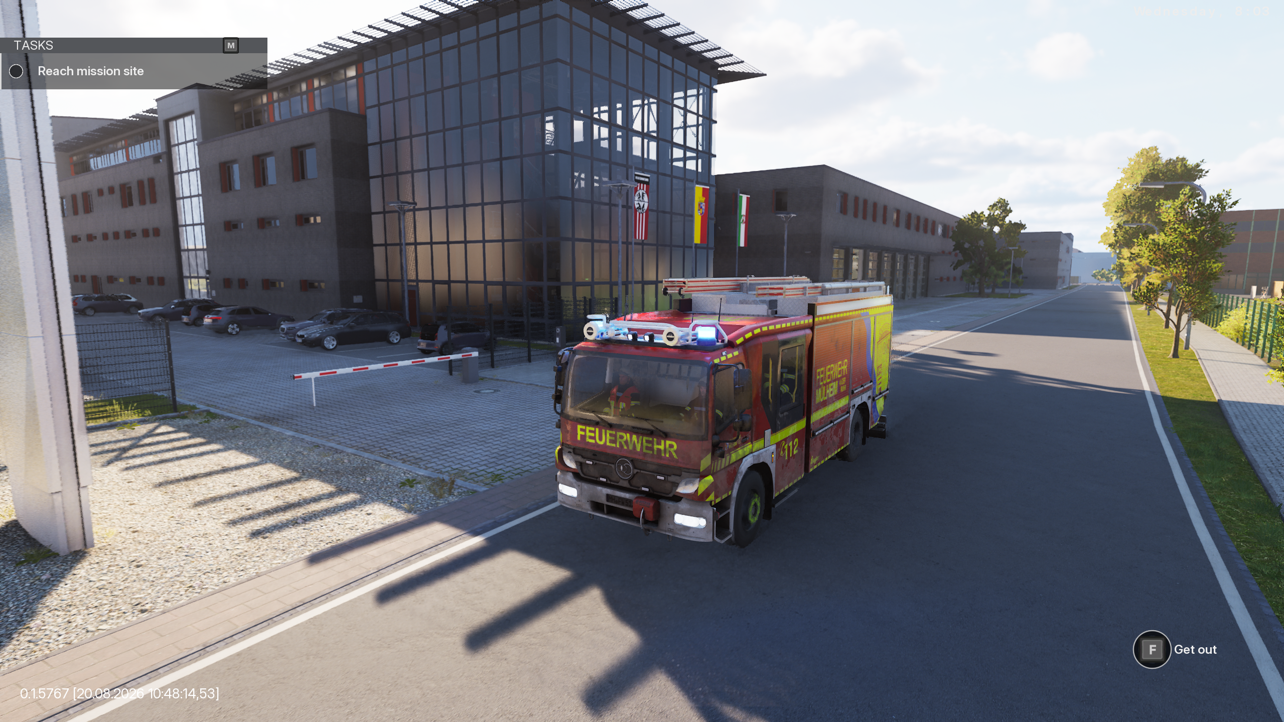 This image shows the fire engine at the fore front of the picture. In the background the fire station can be seen,