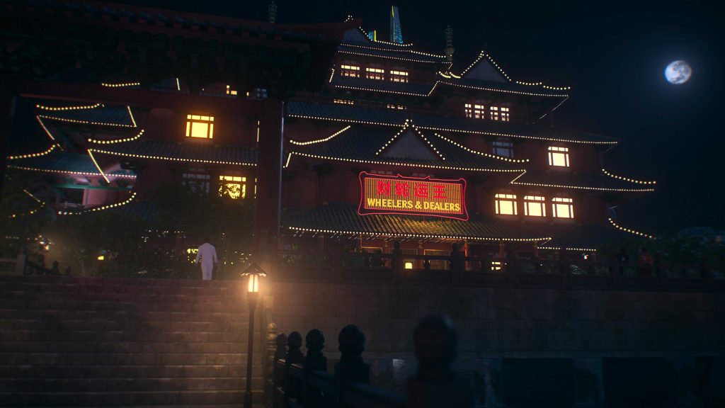 Nighttime view of a traditional Chinese-style building illuminated with string lights and neon signage beneath a full moon.