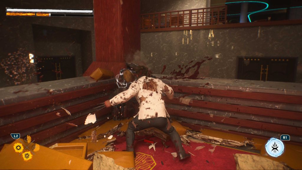 First-person video game view shows a bloodied enemy in a dim wooden room, with health and ability indicators on screen.
