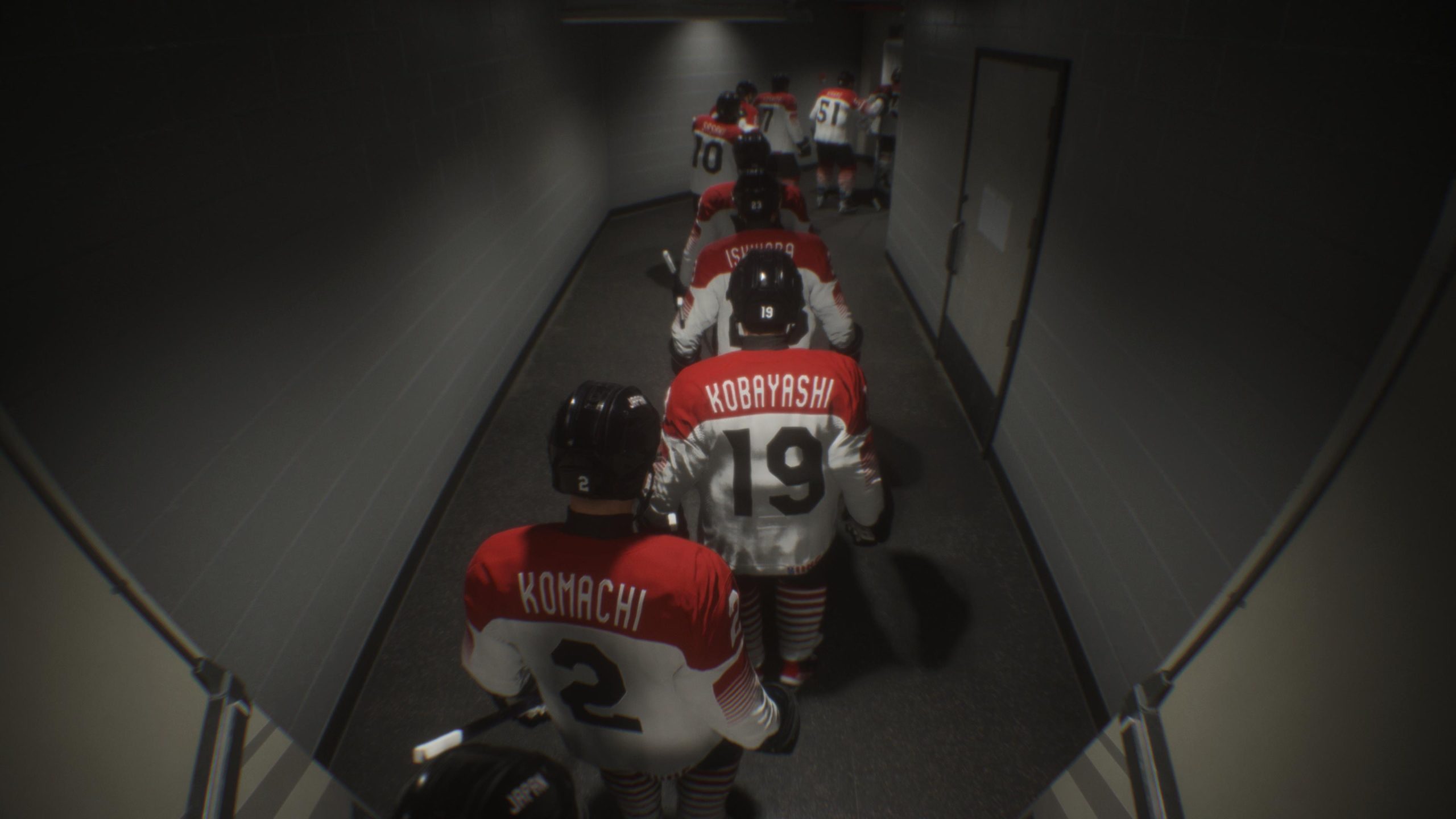 This image shows the players walking out to the ice. The camera angle showing them from the back where their names and numbers are distinctive.