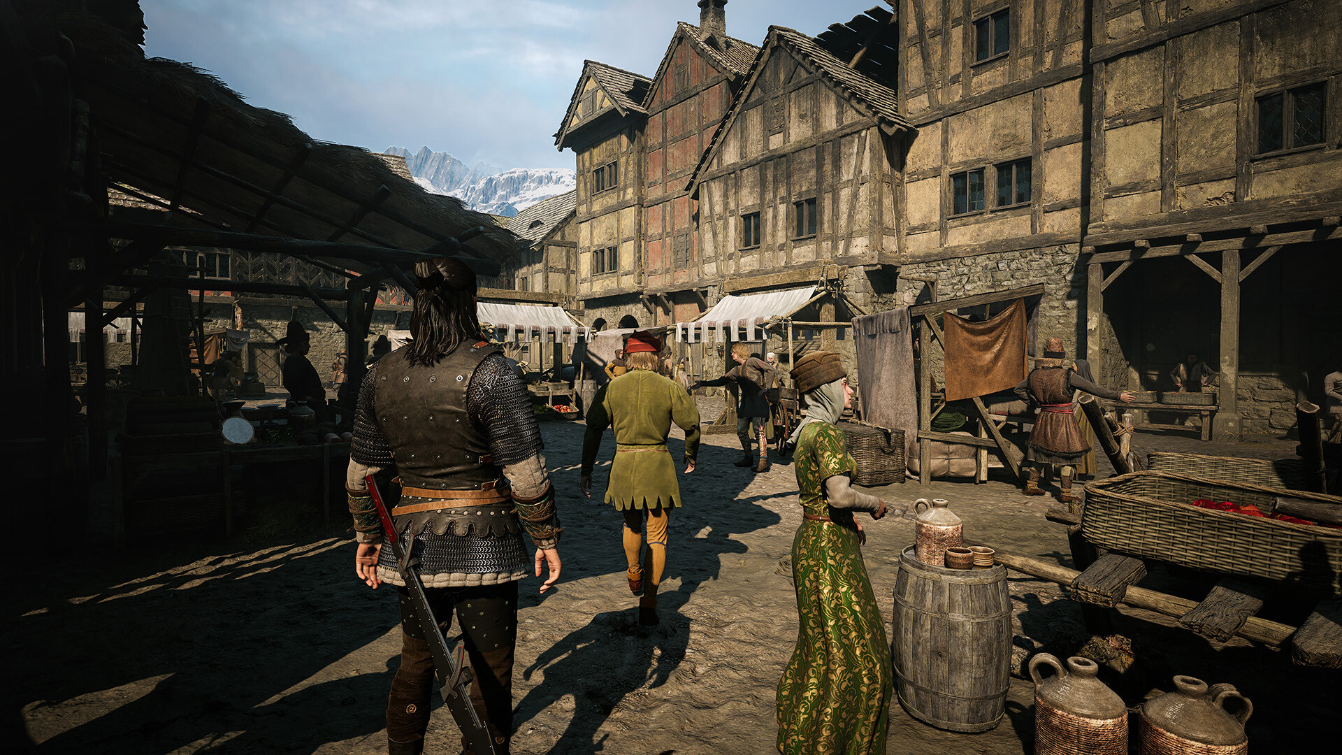 A bustling town, with various NPCs at a market. Coen is stood amongst them.