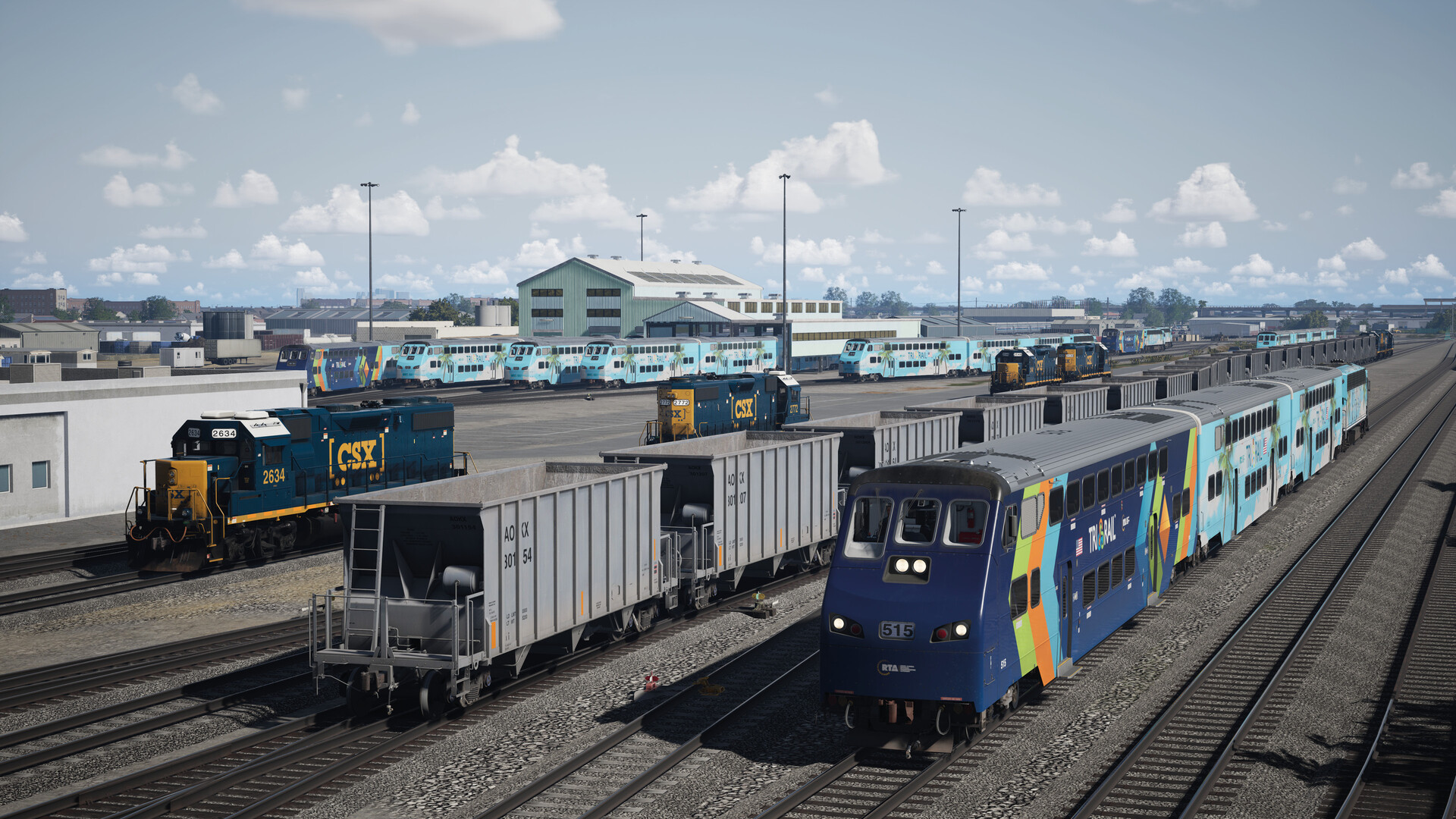 Several trains and freight carts are idle in a depot.