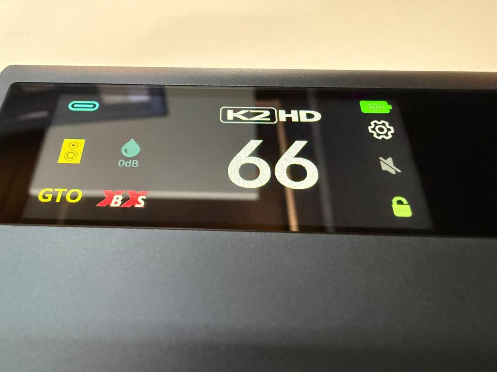 Close-up of a iFi iDSD GR 2 device touch display showing a large reading of 66, 0 dB, GTO and B&S indicators, plus battery, settings, mute, and lock icons.