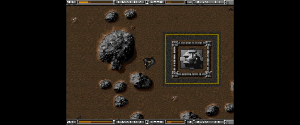 Retro top-down arcade game screen with a rocky brown terrain, scattered boulders, and a small spacecraft near a framed structure; the pixelated scene feels tense and exploratory.