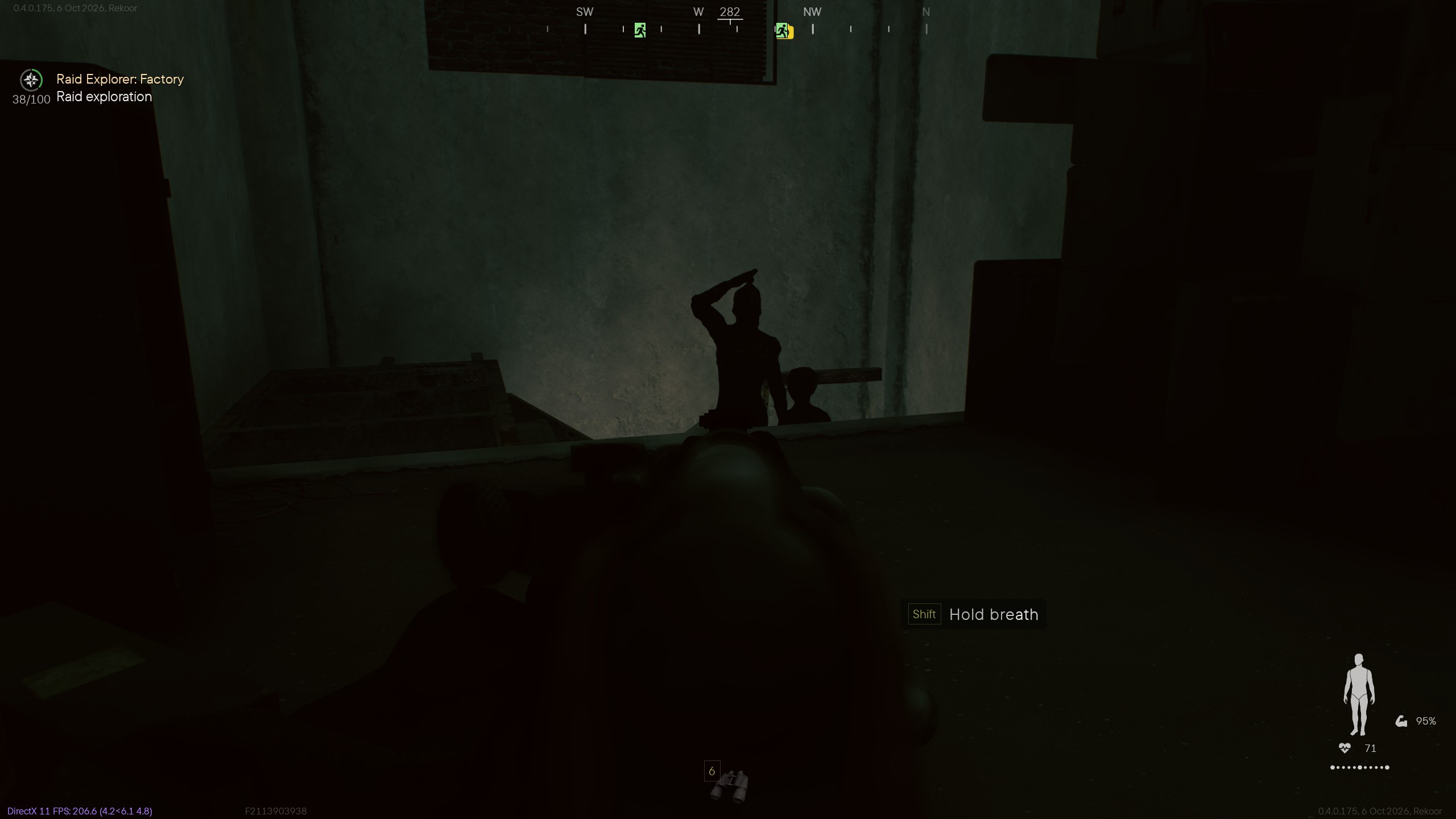 First-person view in a dark factory, aiming a rifle at two silhouetted figures near a concrete wall.