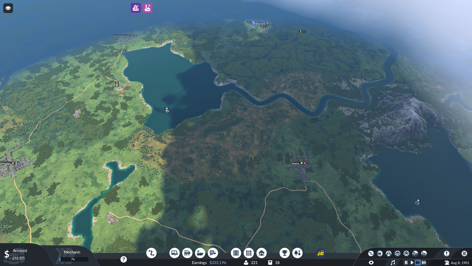 A beautifully rendered landscape with a few symbols on over some populated areas. There are hills, trees, lakes, rivers and mountains. Several gaming options are at the bottom of the screen.