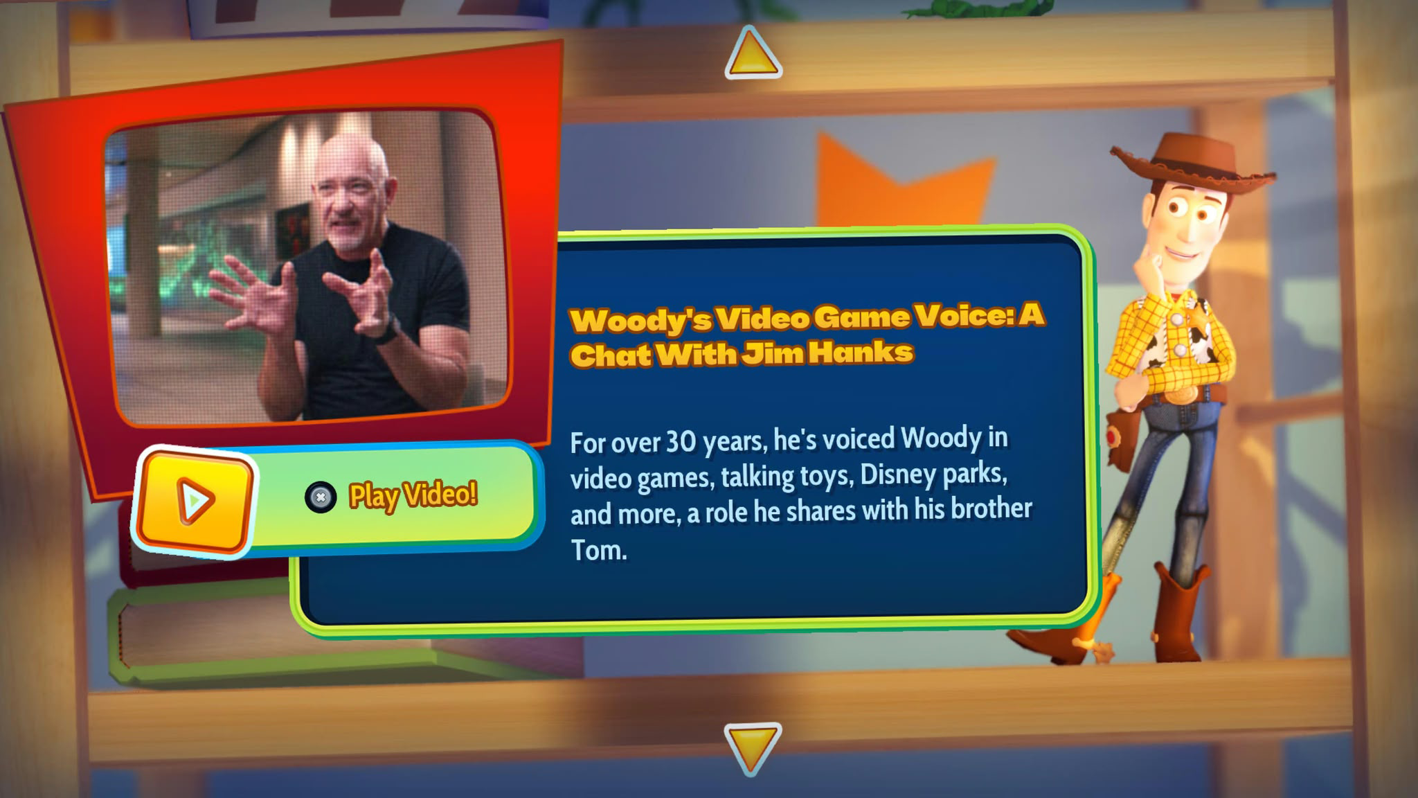 A digital menu screen features a video of Jim Hanks, text about his voice work for Woody, and a Woody toy figure standing on a wooden shelf background.